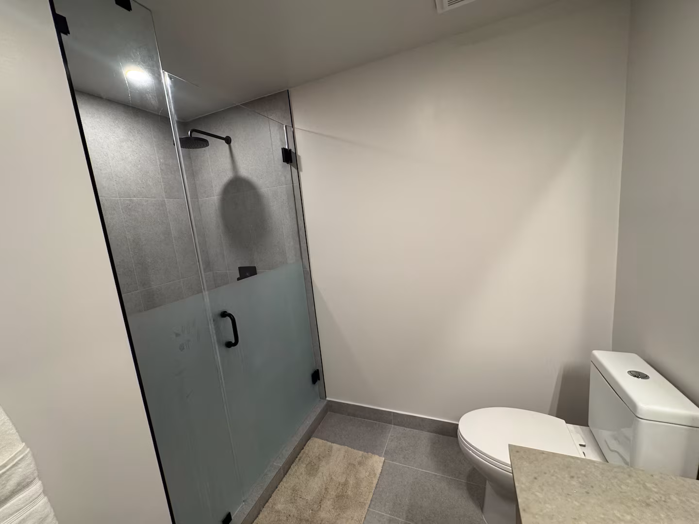 501 First bathroom vanity and shower detail.