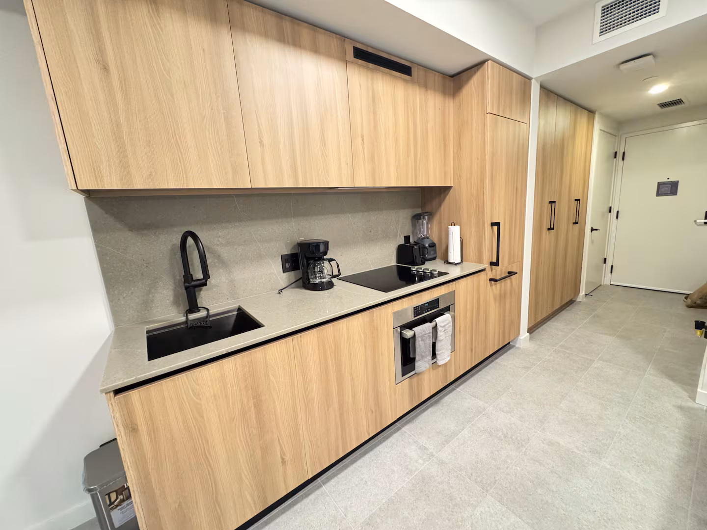 Kitchen with stone surfaces and clean detailing.