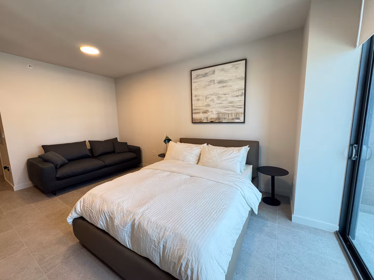 Bedroom with soft light and premium bedding.